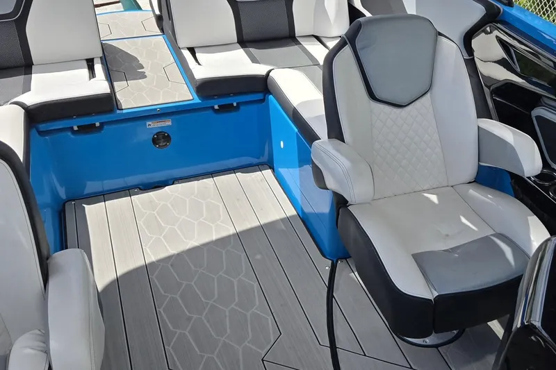 Slide: The Image of Interior of 2022 Yamaha Boats 255XD, featuring sleek seating and modern design. - 26