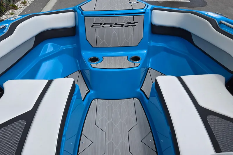 Slide: The Image of 2022 Yamaha Boats 255XD interior with blue and white seating, modern design. - 30
