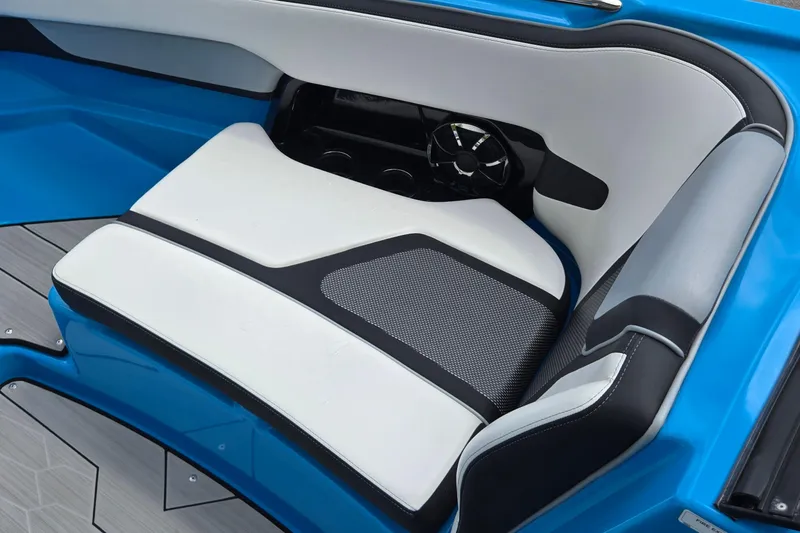 Slide: The Image of Interior seating of a 2022 Yamaha Boats 255XD, featuring sleek white and black upholstery. - 31