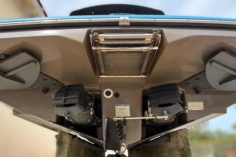 Slide: The Image of 2022 Yamaha Boats 255XD underside view, showcasing dual engines and ladder. - 9