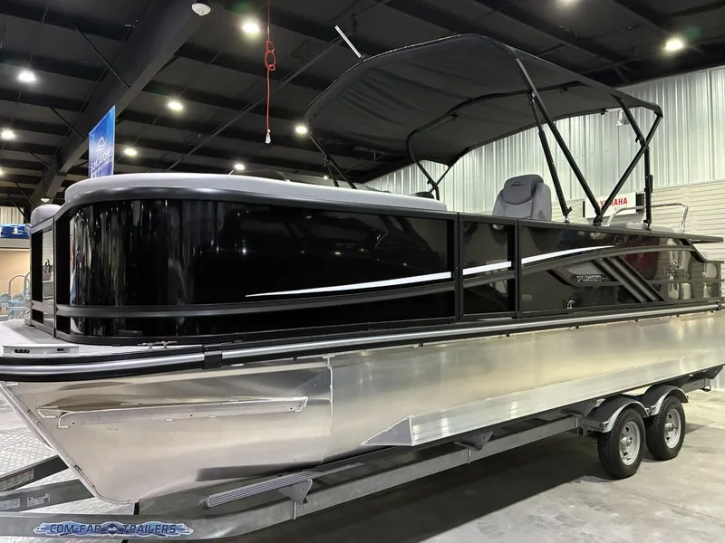 The Image of 2026 SunCatcher Fusion 324SL pontoon boat in a showroom. - 1