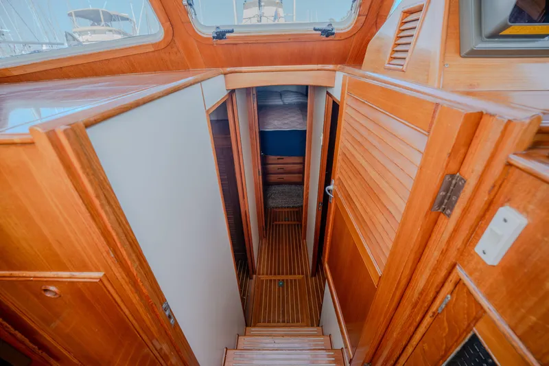 Slide: The Image of Interior view of 1998 Grand Banks 43 Eastbay EX yacht with wooden finishes. - 17