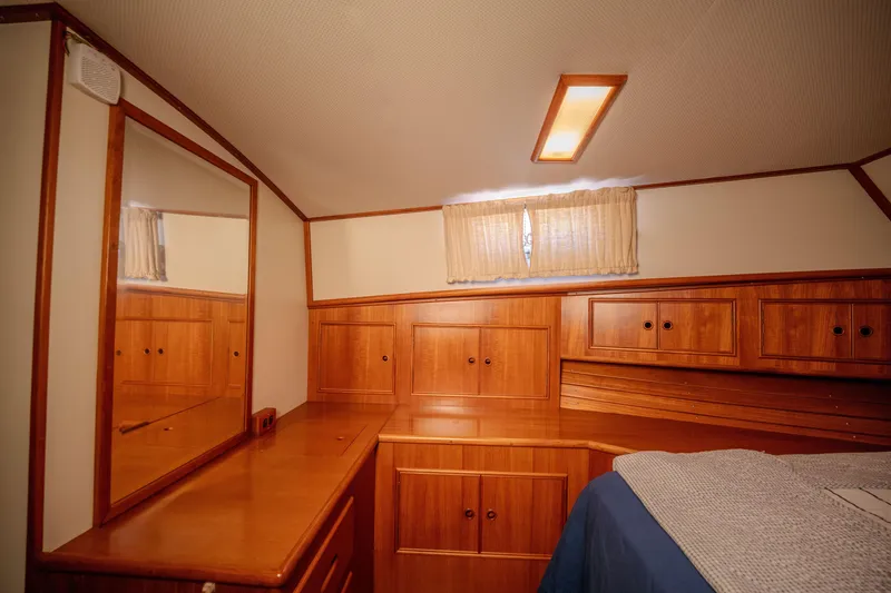 Slide: The Image of Luxurious wooden interior of 1998 Grand Banks 43 Eastbay EX yacht cabin. - 22