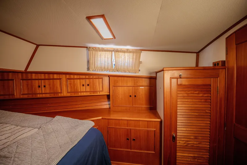 Slide: The Image of Luxurious wooden cabin interior of 1998 Grand Banks 43 Eastbay EX yacht. - 23