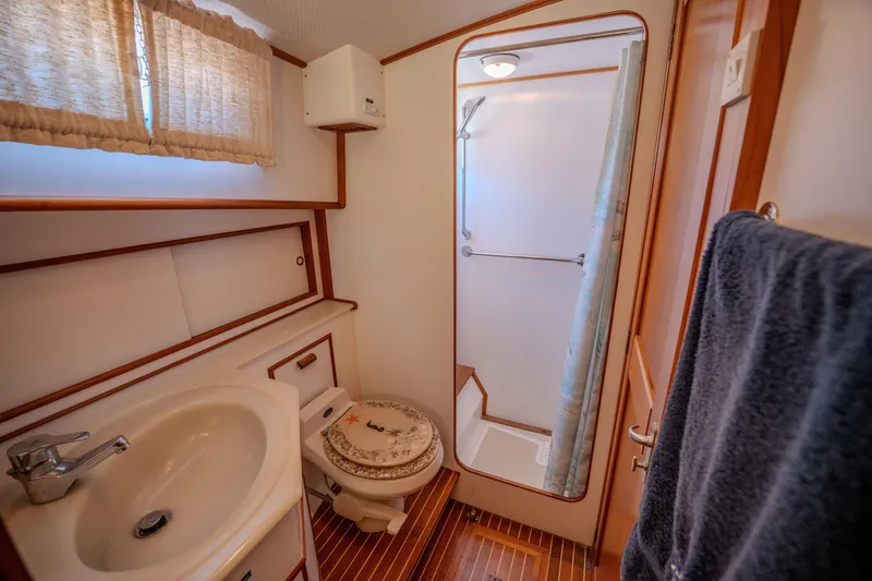 Slide: The Image of Bathroom interior of 1998 Grand Banks 43 Eastbay EX yacht, featuring sink and shower. - 25