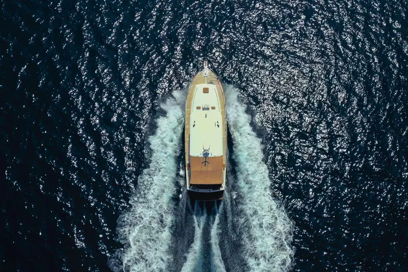Slide: The Image of Aerial view of 1998 Grand Banks 43 Eastbay EX yacht cruising on open water. - 4