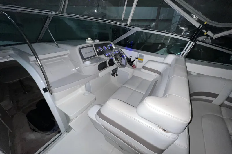Slide: The Image of 1999 Formula 330 Sun Sport boat interior with blue ambient lighting. - 11