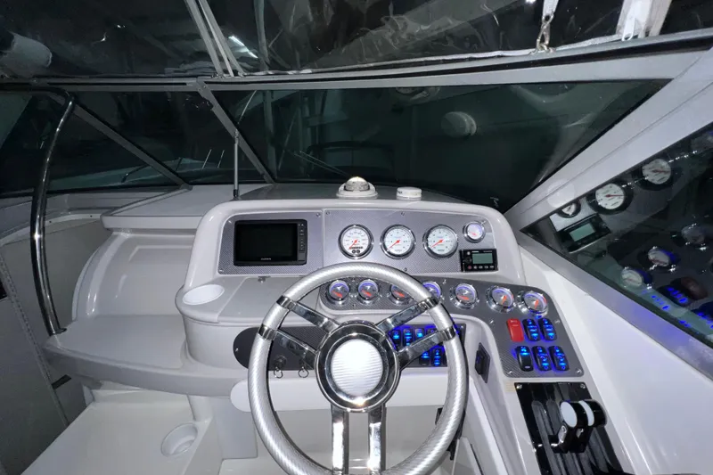 Slide: The Image of 1999 Formula 330 Sun Sport boat interior with blue ambient lighting. - 12