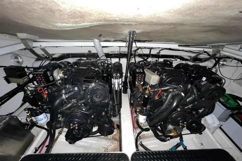 Slide: The Image of Interior of a 1999 Formula 330 Sun Sport boat, featuring a compact kitchenette. - 19