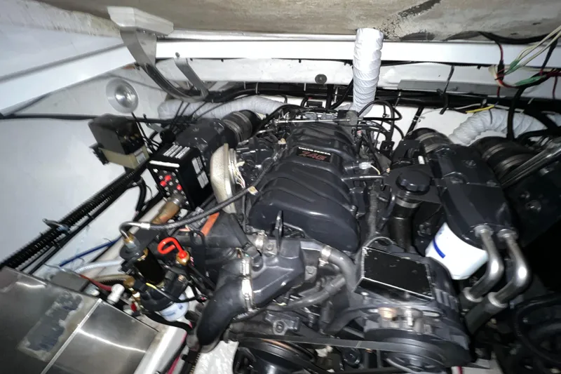 Slide: The Image of Control panel on 1999 Formula 330 Sun Sport boat interior, featuring digital display and buttons. - 20