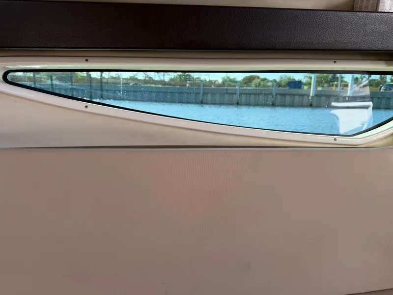 Slide: The Image of Window view from 2015 Regal 28 Express with water scenery. - 11