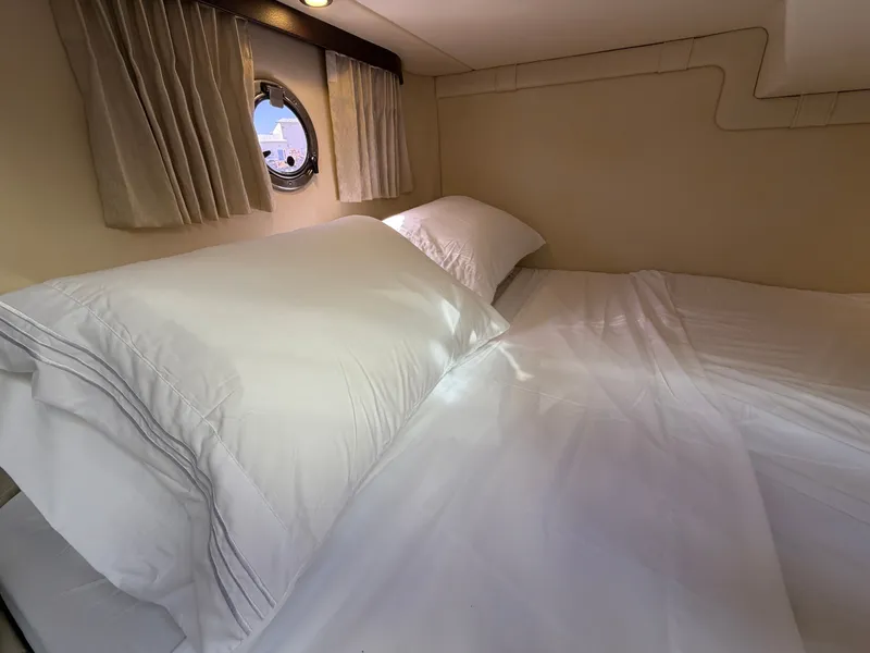 Slide: The Image of Interior of 2015 Regal 28 Express with cozy bed. - 13
