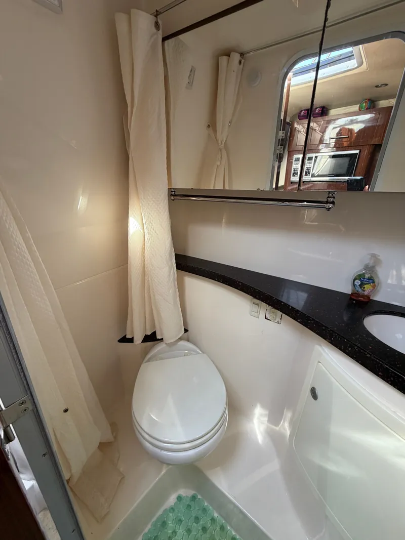 Slide: The Image of Interior view of 2015 Regal 28 Express bathroom. - 14