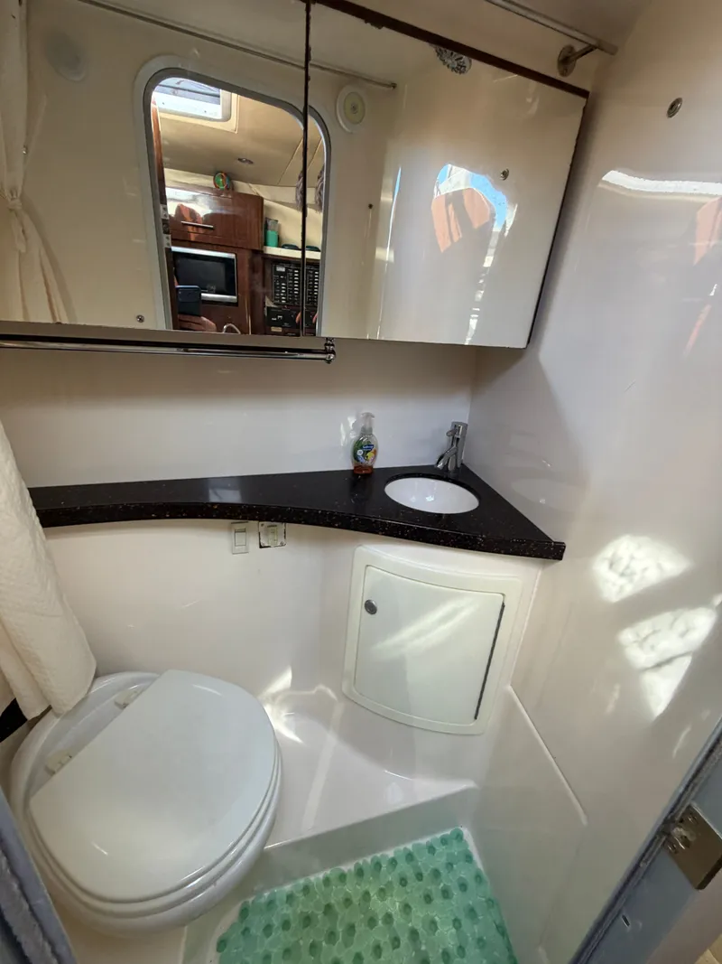 Slide: The Image of Bathroom in 2015 Regal 28 Express boat. - 15