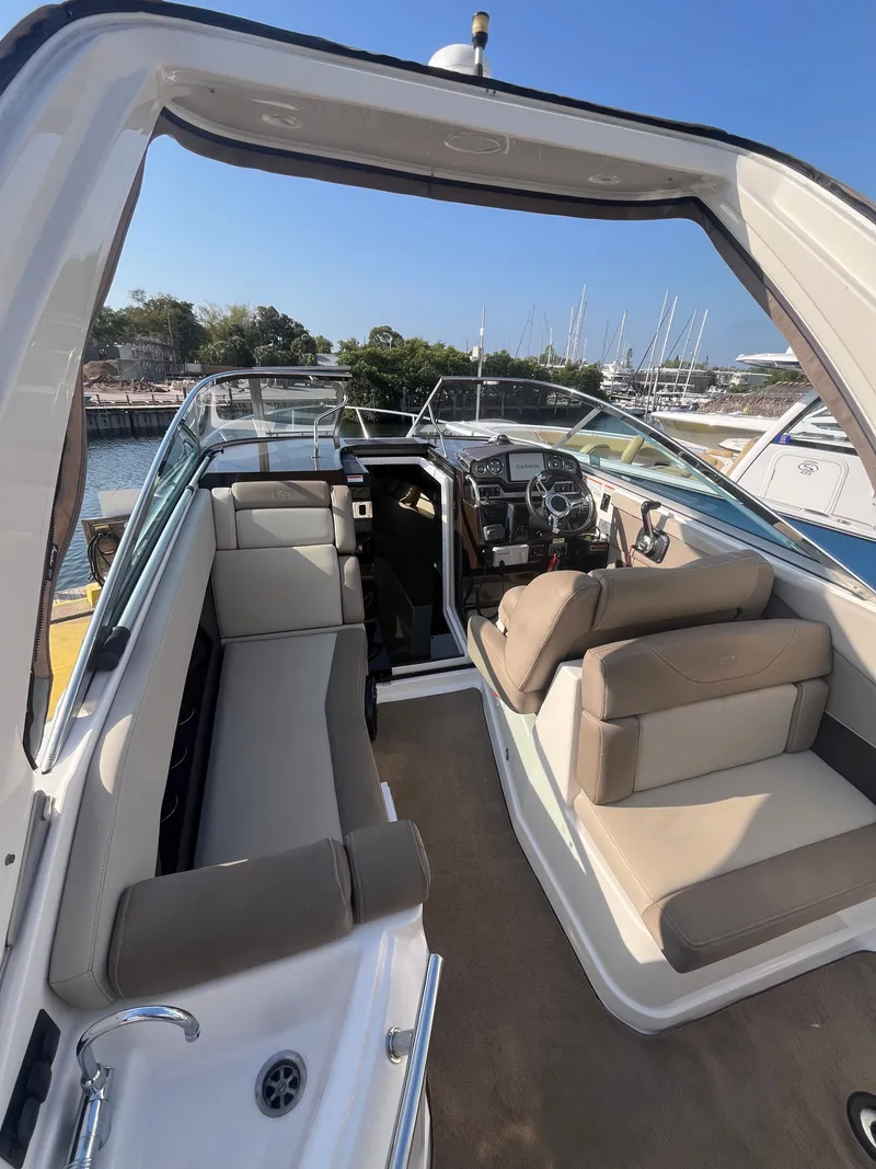 Slide: The Image of Interior of a 2015 Regal 28 Express boat at the marina. - 16