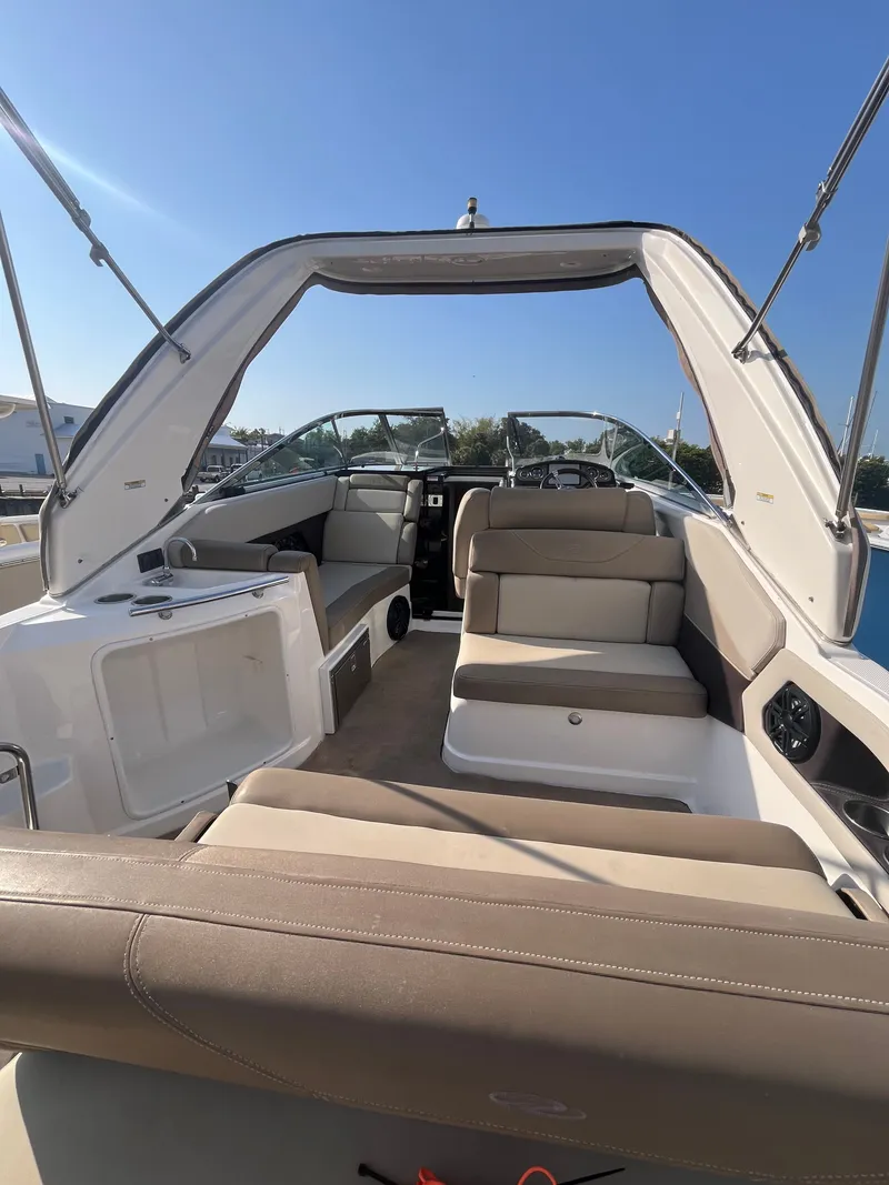 Slide: The Image of Interior of a 2015 Regal 28 Express boat under sunny skies. - 17