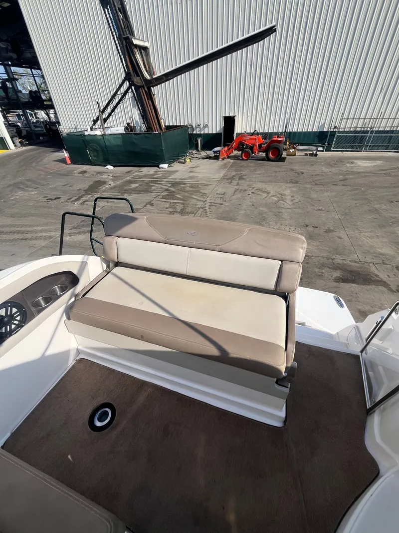 Slide: The Image of 2015 Regal 28 Express boat with beige outdoor seating area. - 20