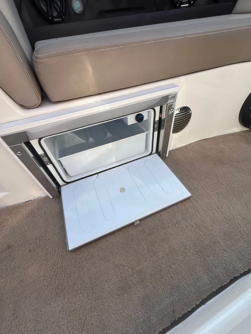 Slide: The Image of Regal 28 Express 2015 boat refrigerator with open door. - 24