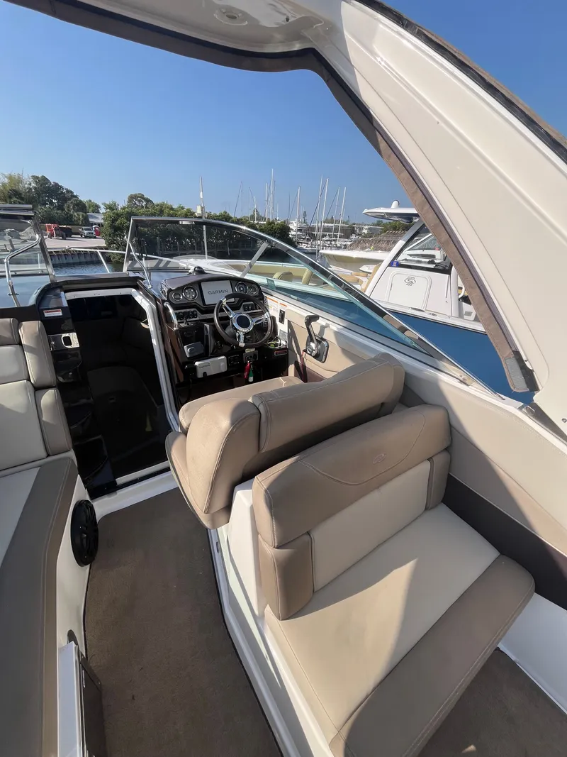 Slide: The Image of Interior of a 2015 Regal 28 Express boat at the marina. - 26