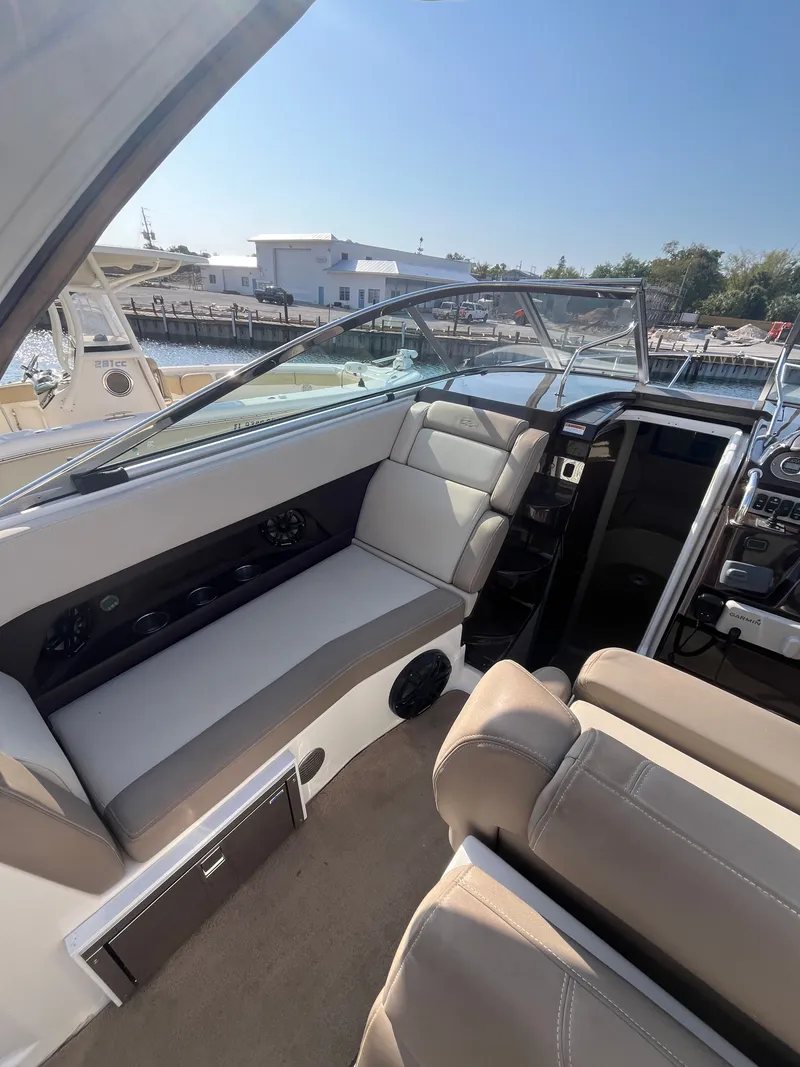 Slide: The Image of Interior of a 2015 Regal 28 Express boat, beige seating. - 27