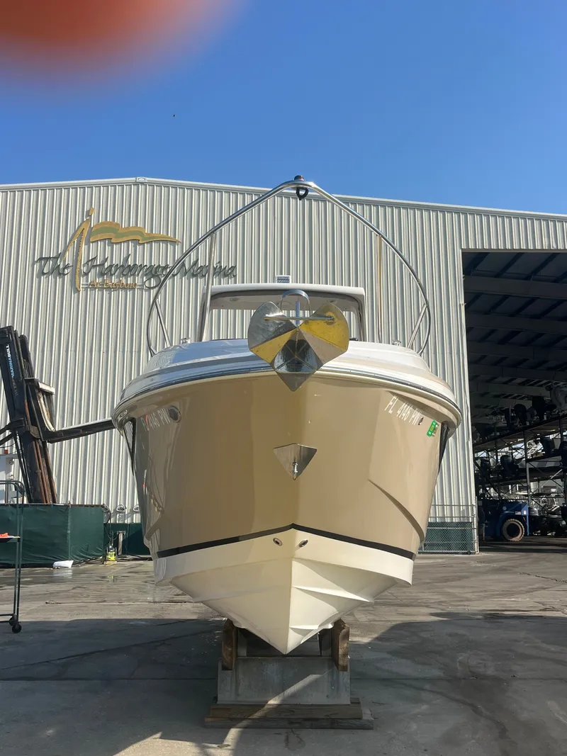 Slide: The Image of 2015 Regal 28 Express boat in front of warehouse. - 3