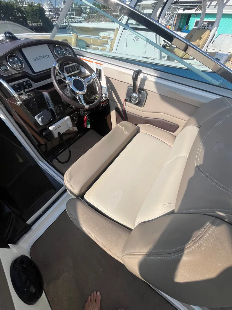Slide: The Image of Interior of a 2015 Regal 28 Express boat with helm console. - 30