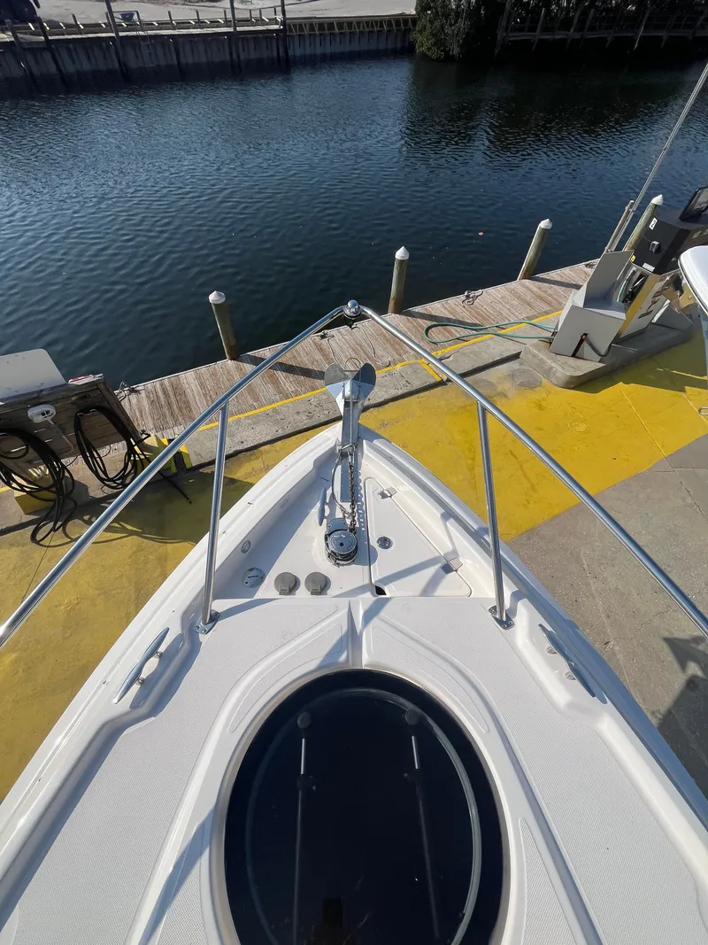 Slide: The Image of 2015 Regal 28 Express at dock, view of bow and water. - 34