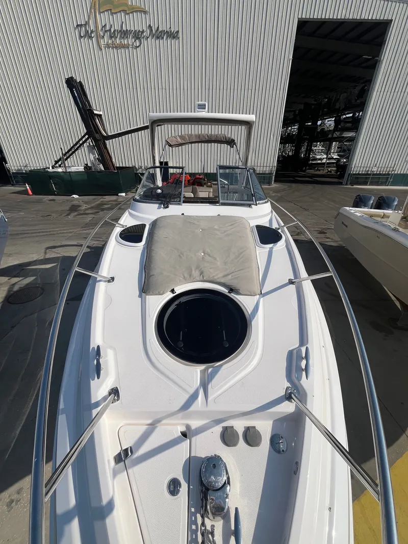 Slide: The Image of 2015 Regal 28 Express boat docked, front view. - 35