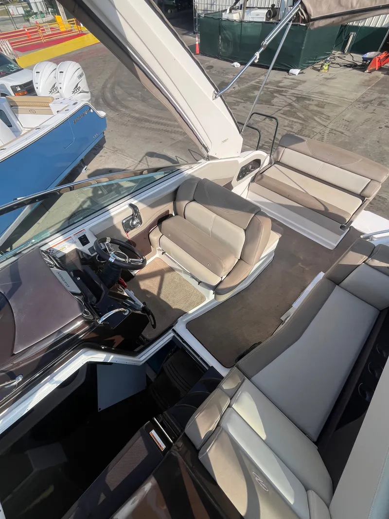 Slide: The Image of Interior of a 2015 Regal 28 Express boat with seating area. - 38