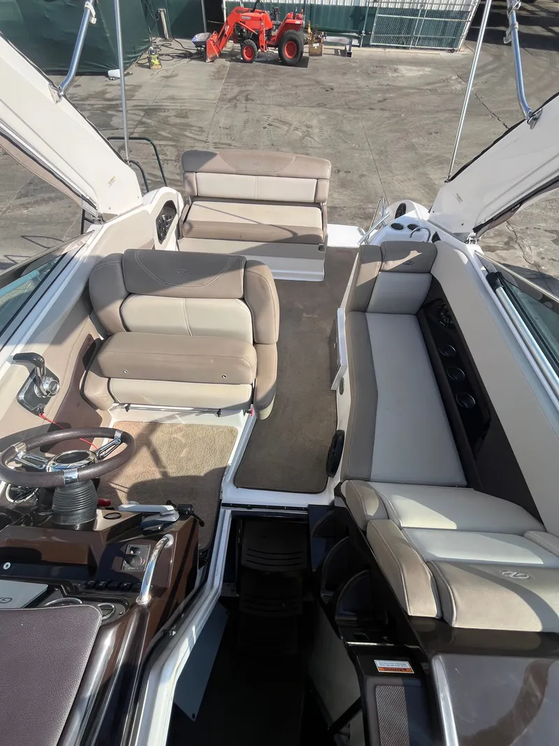 Slide: The Image of Interior of a 2015 Regal 28 Express boat with beige seating. - 40