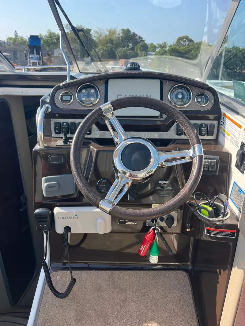 Slide: The Image of Helm console of a 2015 Regal 28 Express boat with Garmin devices. - 41