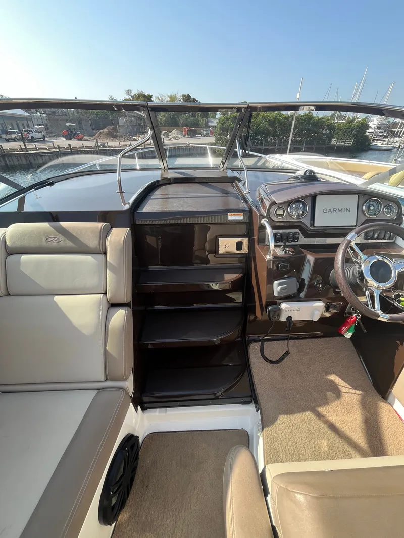 Slide: The Image of Interior of a 2015 Regal 28 Express boat with Garmin navigation system. - 45