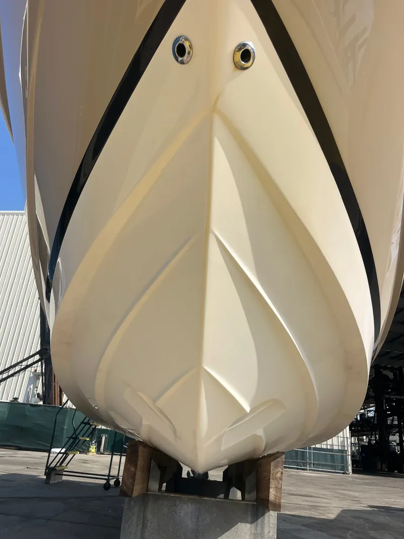 Slide: The Image of Bow view of a 2015 Regal 28 Express boat on stands. - 48