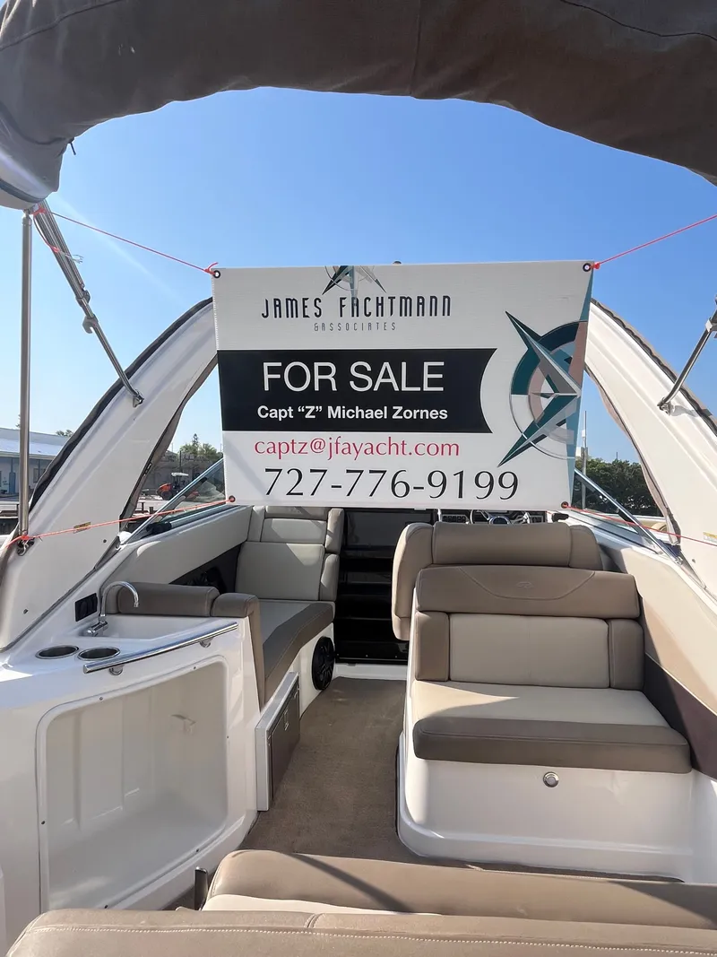 Slide: The Image of 2015 Regal 28 Express boat interior with for sale sign. - 49