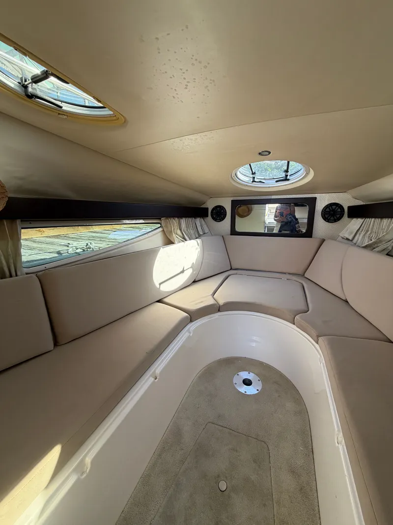 Slide: The Image of Interior of a 2015 Regal 28 Express yacht with beige seating. - 7