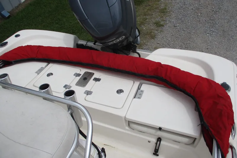 Slide: The Image of 2005 NauticStar 2200 NauticBay boat with red protective cover and Yamaha outboard motor. - 7