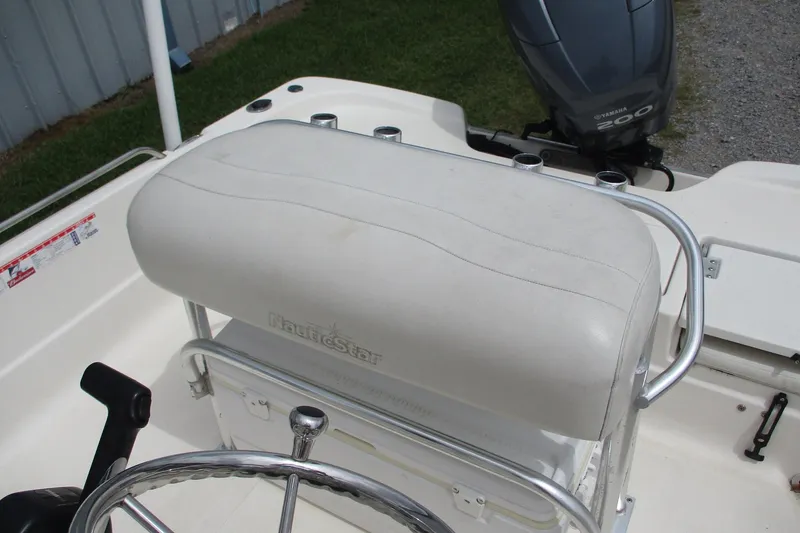 Slide: The Image of 2005 NauticStar 2200 NauticBay boat interior with steering wheel and Yamaha 200 engine. - 8