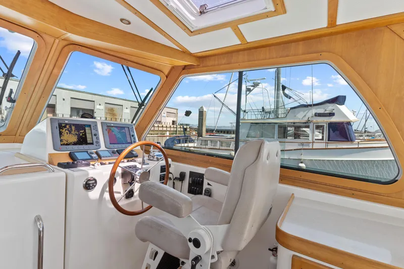 Slide: The Image of Interior view of 2007 Sabre 42 Hard Top Express yacht helm with navigation equipment. - 15