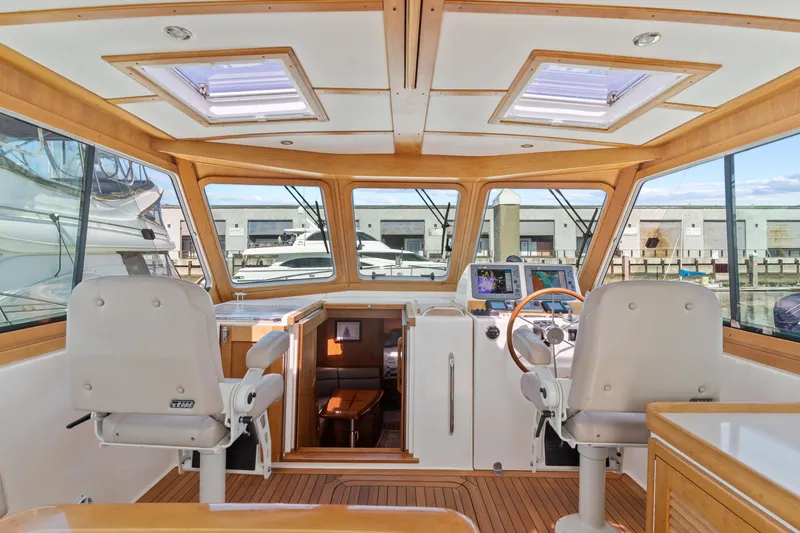 Slide: The Image of Interior of 2007 Sabre 42 Hard Top Express yacht with helm and seating area. - 16