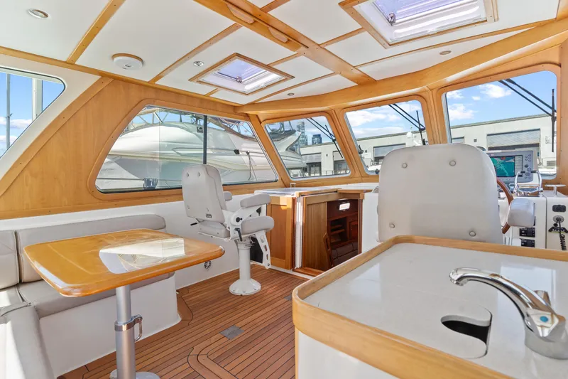 Slide: The Image of Interior of 2007 Sabre 42 Hard Top Express yacht with wood accents and seating. - 17