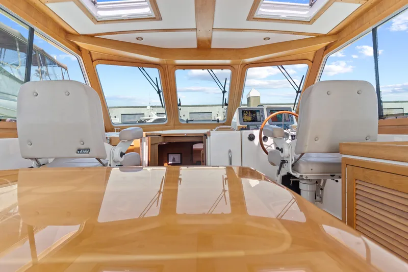 Slide: The Image of Interior view of 2007 Sabre 42 Hard Top Express yacht cockpit with helm and seating. - 19