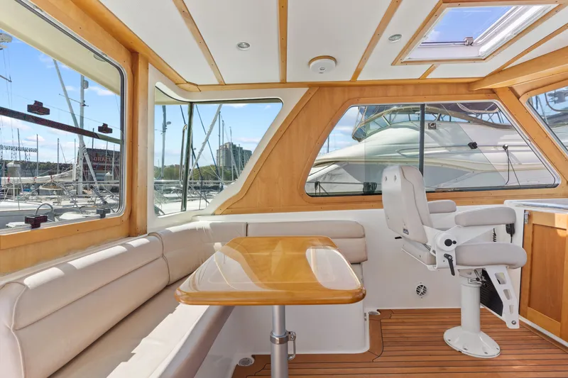 Slide: The Image of Interior of 2007 Sabre 42 Hard Top Express yacht with seating and helm chair. - 20