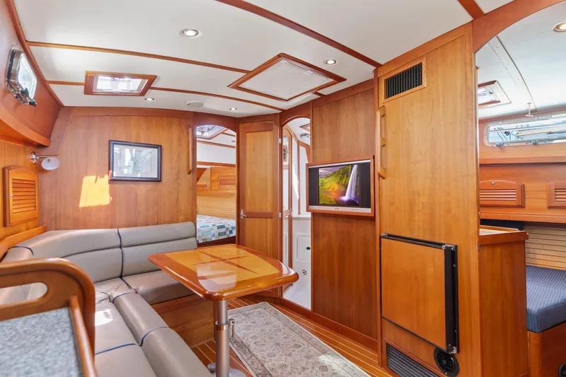 Slide: The Image of Luxurious interior of 2007 Sabre 42 Hard Top Express yacht with wood finish and seating area. - 26