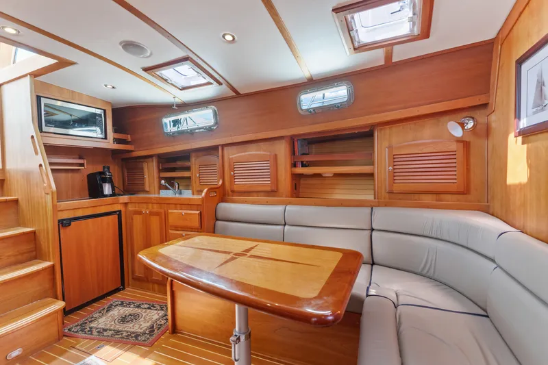 Slide: The Image of Luxurious interior of 2007 Sabre 42 Hard Top Express yacht with wood finishes and seating area. - 28