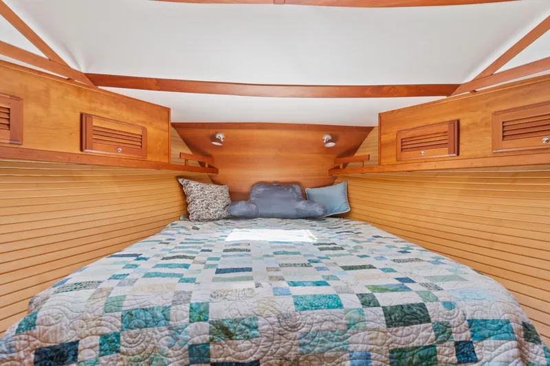 Slide: The Image of Cozy cabin interior of 2007 Sabre 42 Hard Top Express with quilted bedding. - 29
