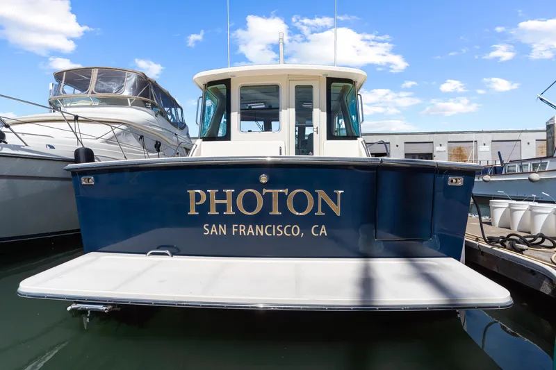 Slide: The Image of 2007 Sabre 42 Hard Top Express boat named "Photon" docked in San Francisco. - 7