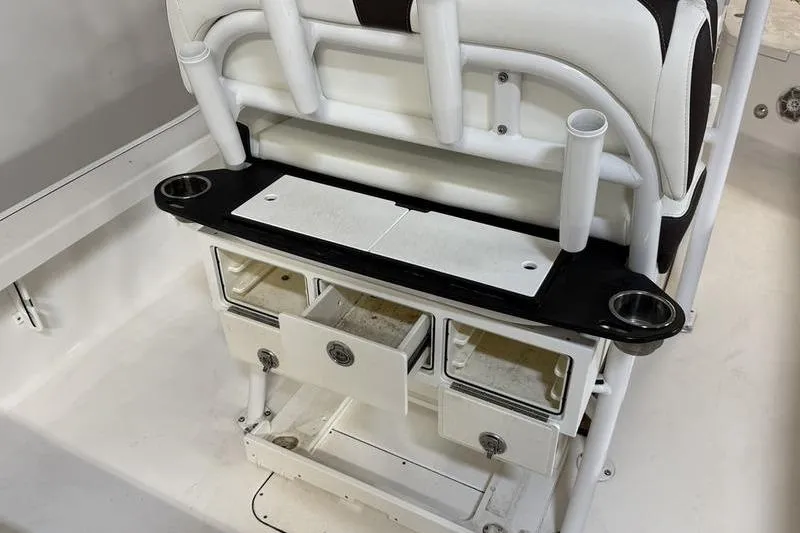 Slide: The Image of 2017 Crevalle 26 HCO boat seat with storage drawers and cup holders. - 10