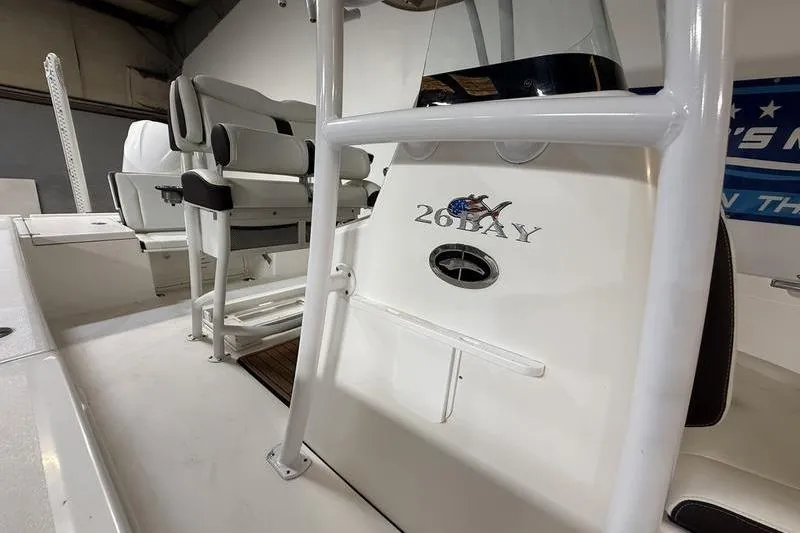 Slide: The Image of 2017 Crevalle 26 HCO boat interior with seating and console details. - 12