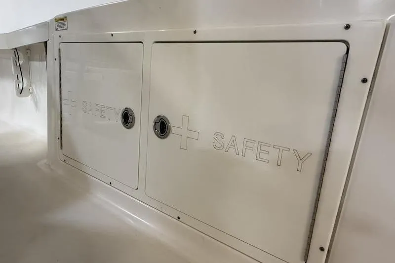 Slide: The Image of Safety compartment on 2017 Crevalle 26 HCO boat, featuring secure storage. - 14