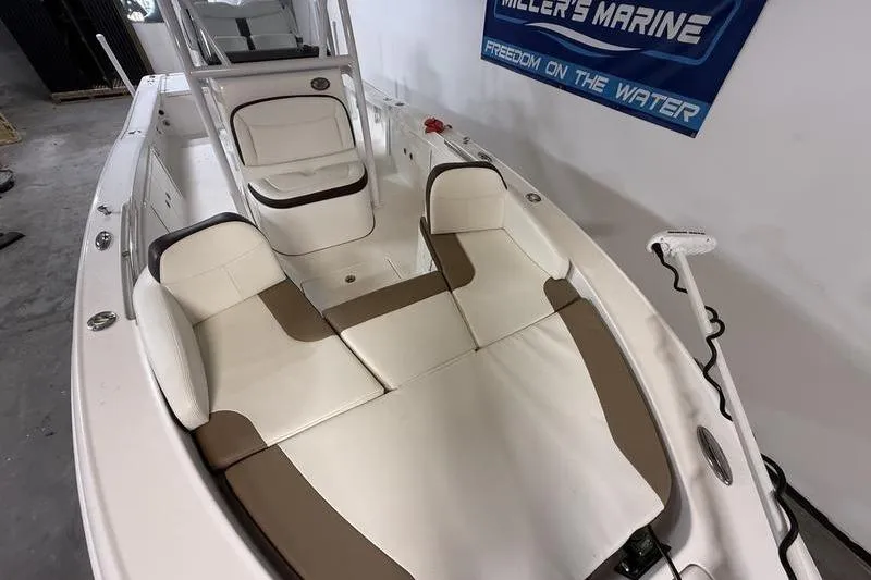 Slide: The Image of 2017 Crevalle 26 HCO boat interior with cushioned seating and helm. - 16